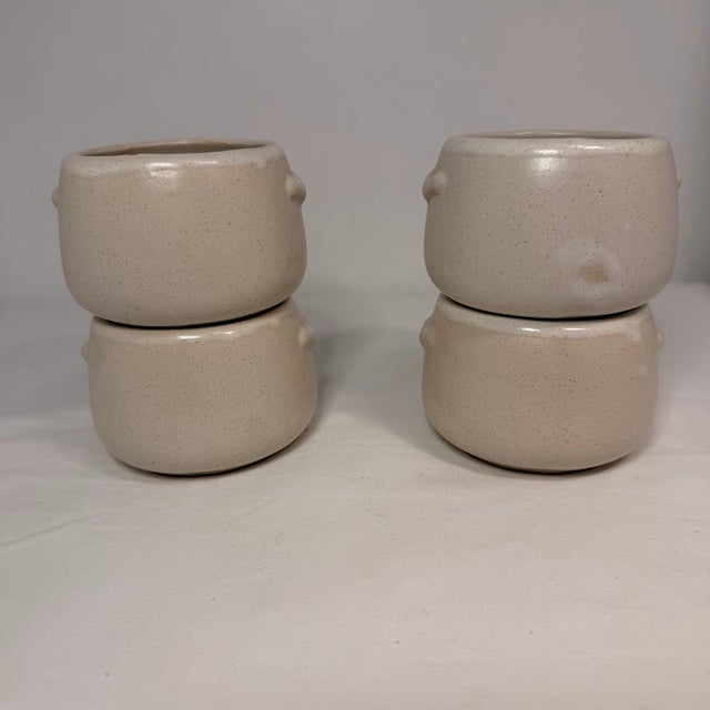 Set of four West Bend stoneware bean pots or soup bowls featuring a unique mid-century modern graphic of a stylized fish...