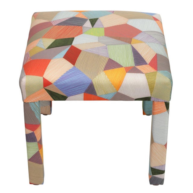 A vibrant pair of vintage benches, newly upholstered in a colorful strié patchwork fabric featuring a multicolored palette...