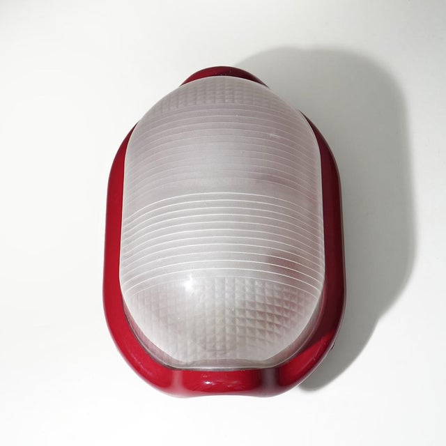 A “Noce” wall or ceiling lamp designed by Achille Castiglioni for Flos in the 1970s, a project that interprets light as an...
