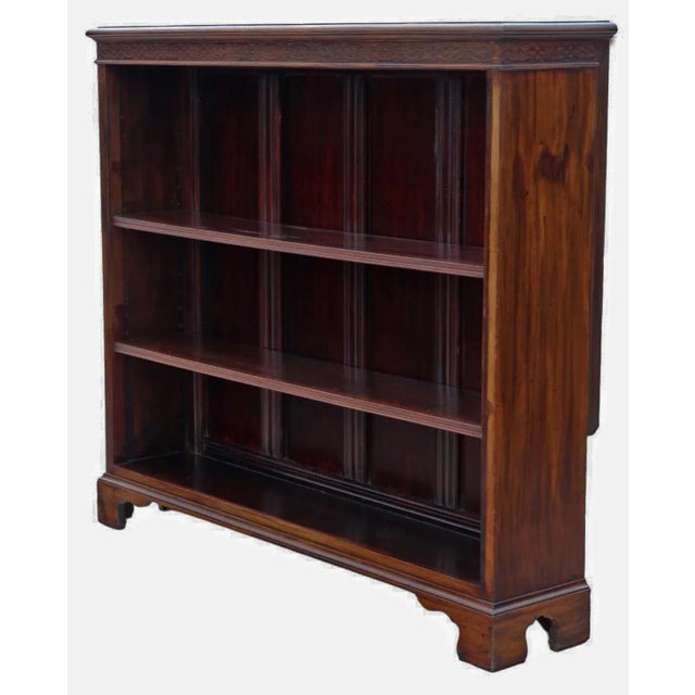 Presenting a Large Quality Antique Red Walnut Adjustable Bookcase from circa 1900. This bookcase exudes lovely quality and...