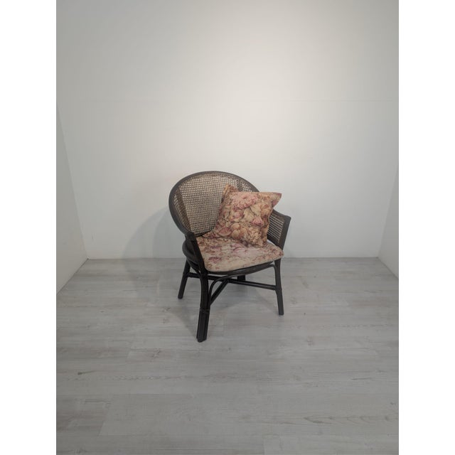 Vintage Raffia Armchair with Viennese Braid Stylish, vintage raffia armchair with Viennese braid and floral cushions. This...