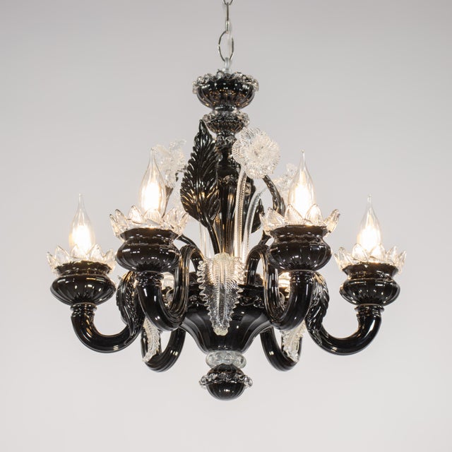 A splendid vintage Baroque-style “Ca’ Rezzonico” Murano chandelier in dramatic black and clear cristallo glass, in the...