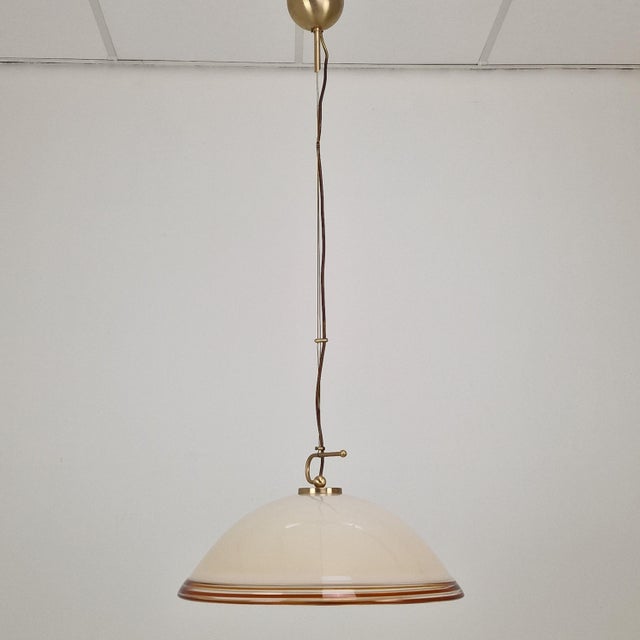 A striking statement in late mid-century design, this italian pendant light was produced by the renowned glassmaker...