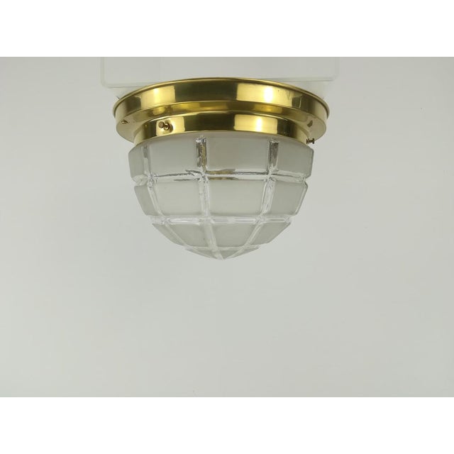Simple Viennese brass ceiling lamp in the shape of a blown glass shade. The lamp has been rewired and re-electrified to...