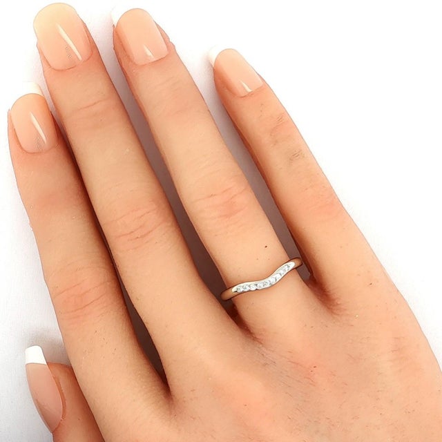 This elegant authentic ring by Tiffany & Co. from designer Elsa Peretti reflects the designers signature minimalist...