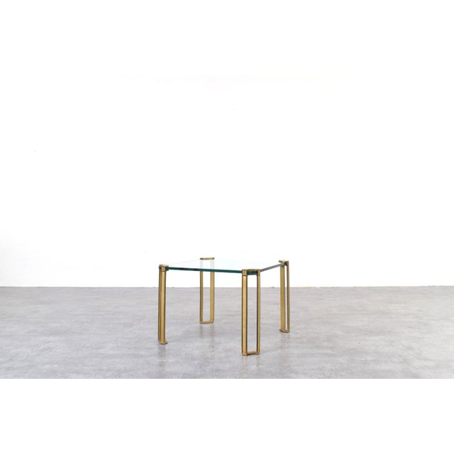 This square coffee table was designed in the 1970s by world-renowned Hungarian designer Peter Ghyczy and manufactured in...
