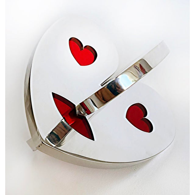Polished Aluminum Interlocking Hearts Sculpture with Translucent Epoxy Resin Offered for sale is a polished aluminum and...