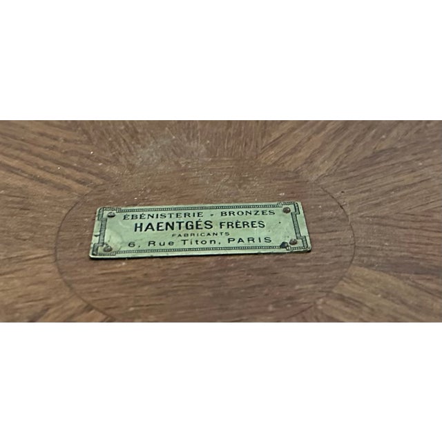 A napoleon iii style pedestal table in rosewood veneer, circa 1890. The top is edged with a molded border, and the...