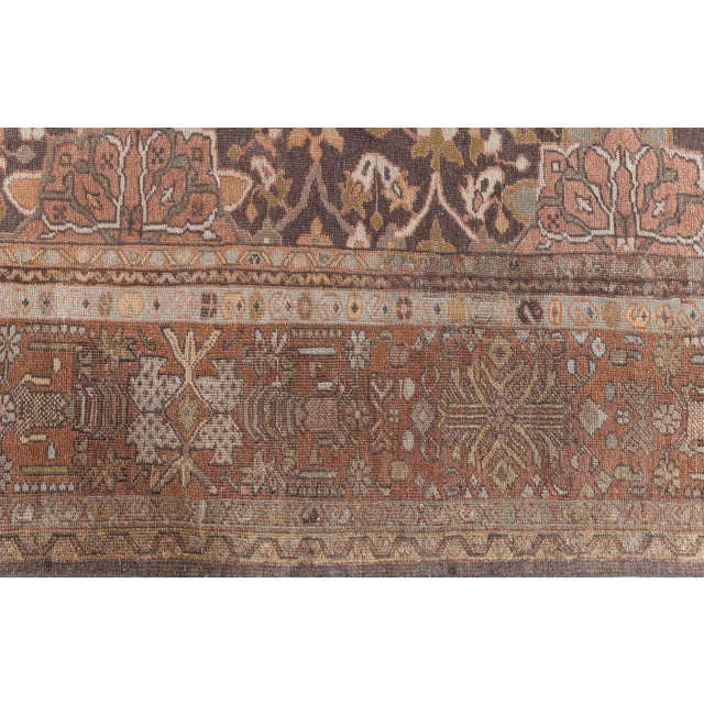 Radiating the grandeur of 19th-century Persian craftsmanship, this magnificent Antique Sultanabad Rug from the 1880s is a...