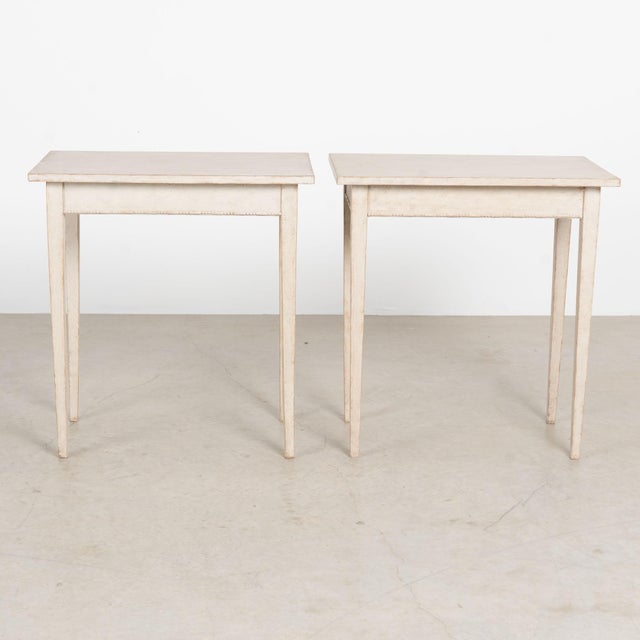 Pair, Gustavian pine side tables with slender tapered fluted legs; simple beaded trim accents the lower skirt. Restored,...