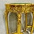 Elevate your living space with this exquisite French-style side table. Fully adorned with luxurious gold leaf, this piece...