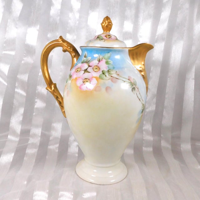 This is a Deliniers and Cie Limoges Chocolate pot in an unknown pattern. The base is signed F. Page 1912 and the Deliniers...