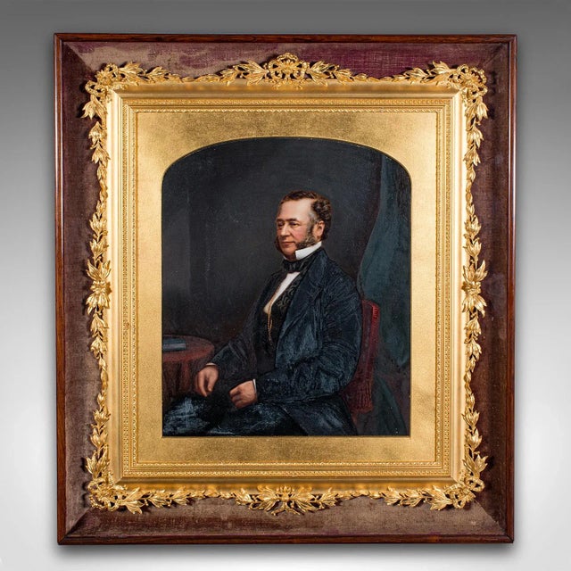 This is an antique gentleman's portrait. An English, painted print in glazed giltwood frame in the English School manner,...