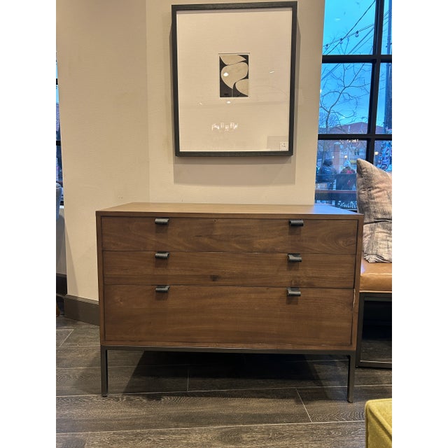 Simple style, inspired by midcentury décor. Made from auburn-finished poplar with black top-grain leather handles, a roomy...