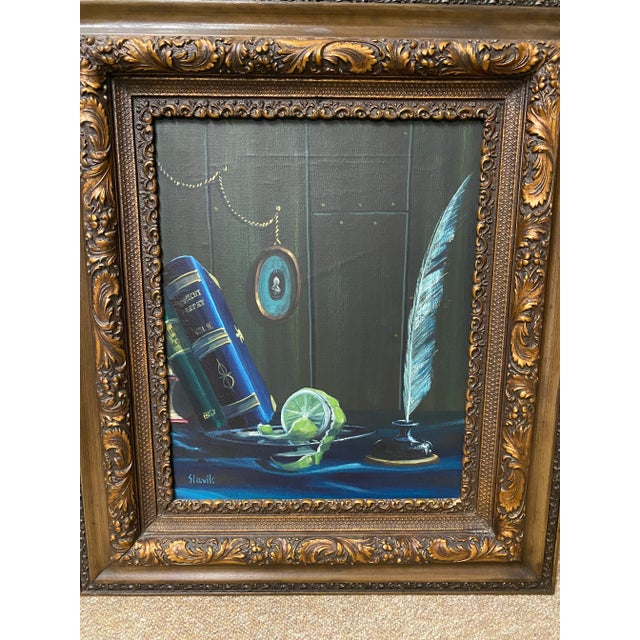 Wonderful, vintage, moody still life with loads of detail in the wood paneled wall, books, feather, cameo, lime and...