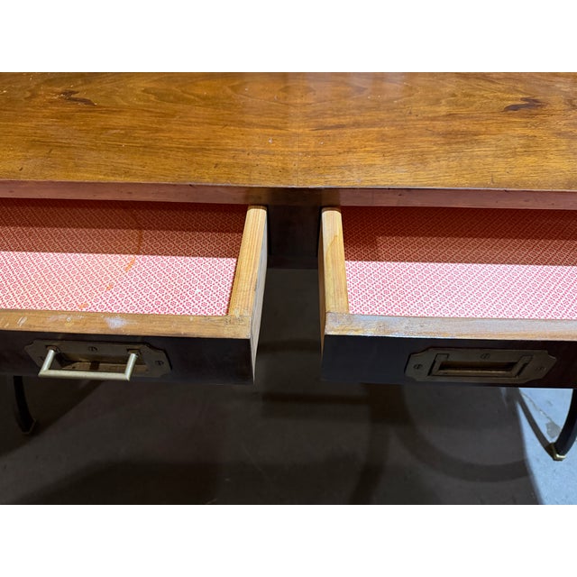 Handsome vintage campaign-style writing desk featuring a richly grained wood top and case, classic inset brass campaign...