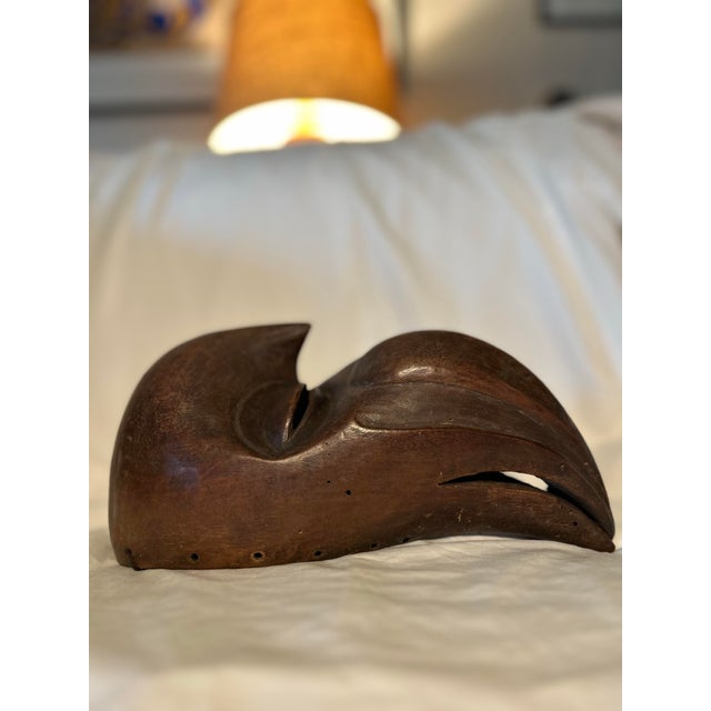 This mask was made by the Dan people along the Ivory Coast in the Zoomorphic Ge Gon style. The Hornbill bird is sacred and...