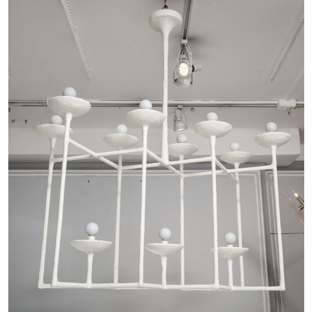 Bespoke Plaster fixture in the manner of Giacometti with eleven-lights. Please note this item can be made to order. We...