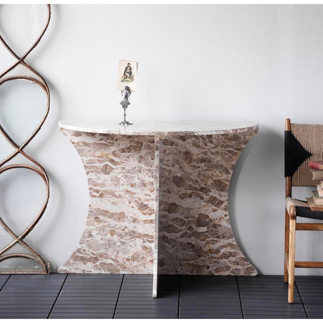 New special order item. Not vintage. Shaped from richly hued panther marble, the Constantine Marble Console Table is a...