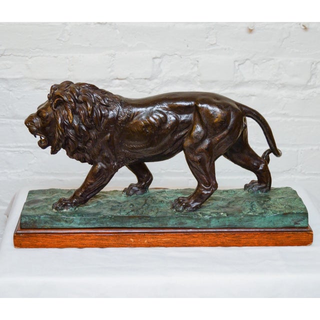 Maitland-Smith bronze roaring lions, handmade in the Philippines. Each lion strides forward mid-roar with a full, finely...