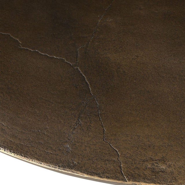 Round dining table crafted from weather-resistant cast aluminum in a rich dark bronze finish that lends warmth and...