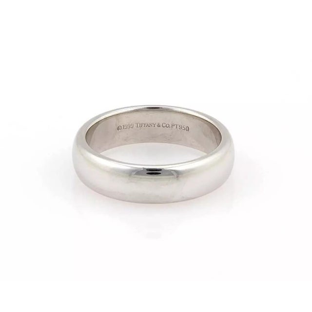This is an elegant authentic wedding band from Tiffany & Co. well crafted from solid platinum with a polished finish. The...
