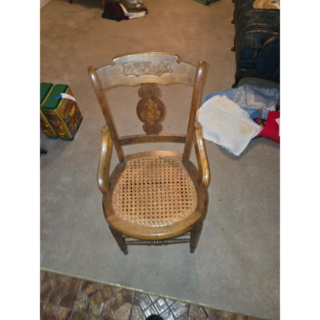 Set of 6 vintage wooden dining chairs with woven cane seats and decorative back panels. Classic and charming...