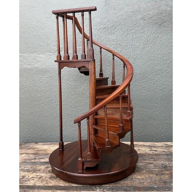 This masterfully crafted architectural model of a spiral staircase is an exceptional tribute to the tradition of...