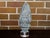 A zinc crowned acorn decorative object from circa 1920 mounted on a circular lucite base. This charming zinc crowned acorn...