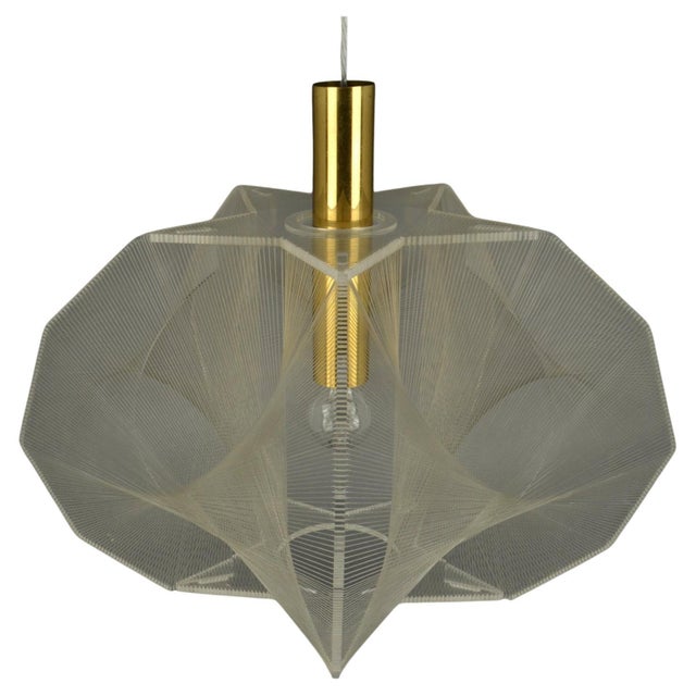 Sculptural lamp in star shape formation of clear acrylic glass and clear transparent wire accompanied brass internal...