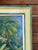 A lush and vibrant vintage oil painting on board depicting a serene tropical landscape — swaying palms, flowering foliage,...