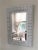 Simple and Intricately Woven Heavy Wicker Curved Frame, painted in glossy white, Henry Link Style. From a South Florida...