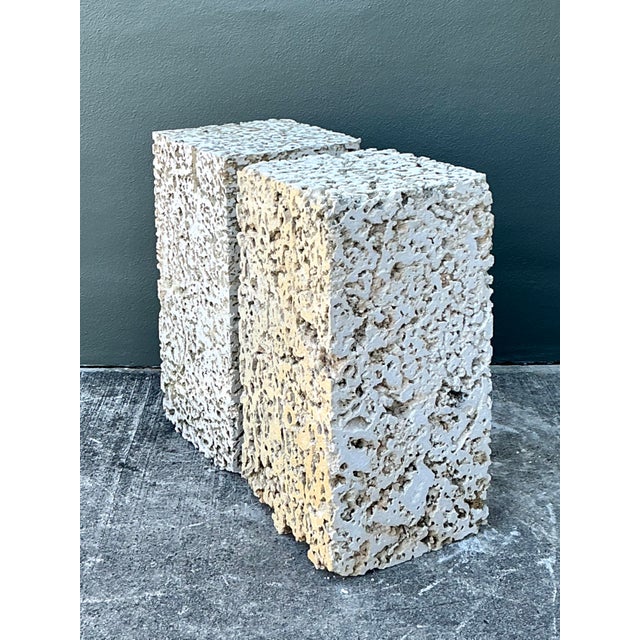 This striking pair of vintage pedestals is expertly crafted from natural Coquina stone, a rare sedimentary rock composed...