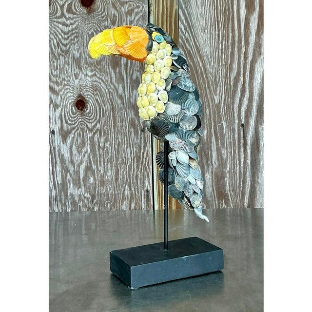 Capture the essence of coastal charm and tropical whimsy with this delightful vintage toucan sculpture. Expertly...