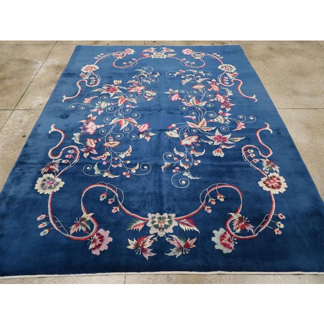 A vintage Chinese Art Deco room size carpet handmade during the Mid-20th Century. Measures: 8' 11" x 11' 7".