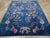 A vintage Chinese Art Deco room size carpet handmade during the Mid-20th Century. Measures: 8' 11" x 11' 7".