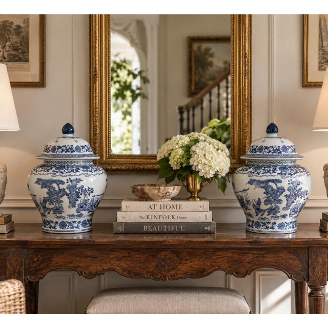 A classic pair of blue and white ginger jars, decorated throughout with delicate Chinese landscapes and floral motifs. The...