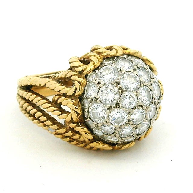 A stunning vintage Hammerman Brothers cocktail ring crafted in luxurious 18 karat yellow gold and set with approximately...