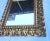 Antique Italian gilt wooden mirror. Mid-19th century carved frame with a modern clear mirror. Heavily carved and intricate...
