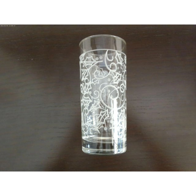 Lovely set of eight vintage clear holiday highball glasses/tumblers featuring a raised swirl holly berry design in white...