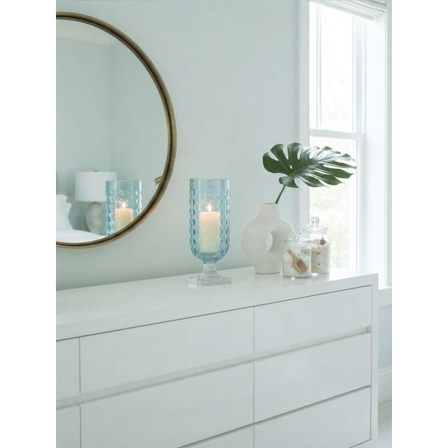 Elevate your interior or exterior staging with this striking vintage light aqua glass hurricane lantern. Masterfully...