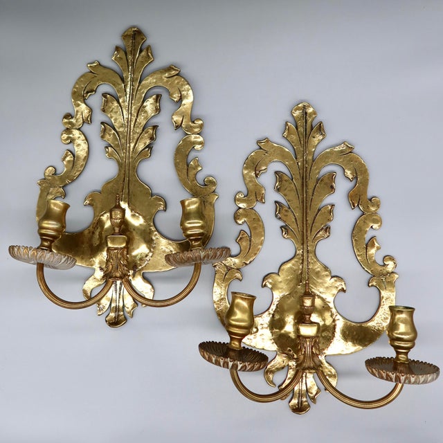 A stunning pair of solid brass two-arm candle wall sconces in the Rococo Revival style, likely Continental European...