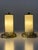 Set of two rare, lovely and highly decorative mid-century modern brass and opaline glass bedside table lamps. Designed and...