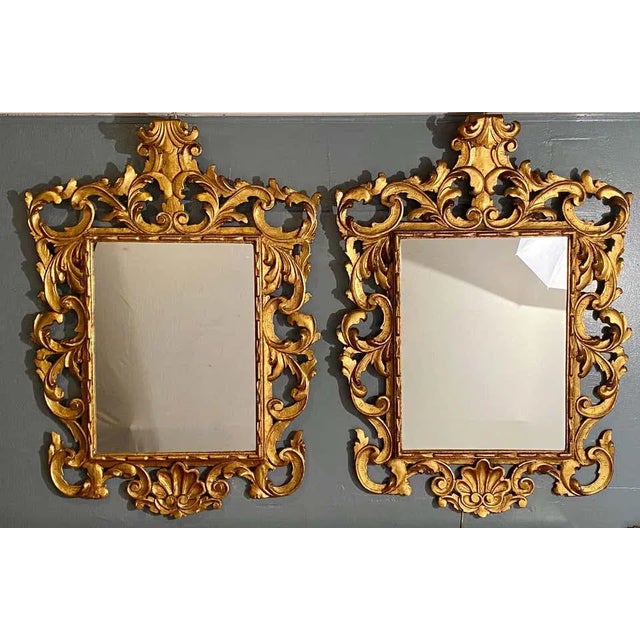 Pair of Rococo Style frame wall or console mirrors. This fine pair of Italian carved gilded wood surrounds these fine...