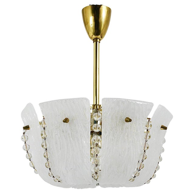 A beautiful, petite austrian mid-century brass chandelier from the 1950s, manufactured by j.t. Kalmar, vienna. This...