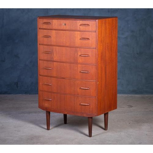 Elegant six-drawer chest crafted in teak and produced by Ølholm Møbelfabrik in Denmark during the 1960s. This piece...