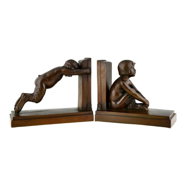 A rare and sculpturally refined pair of Art Deco bronze bookends, known as “Sit and Push,” created by Paul Silvestre circa...