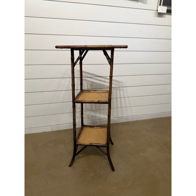 This wonderful chinoiserie bamboo plant stand heralds from the 19th Century English Aesthetic movement and shows its...