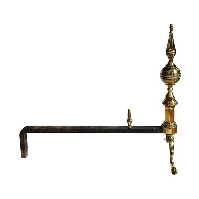 Pair of antique American Federal style brass andirons. Elegant steeple top rising on spurred cabriole legs with pad feet....