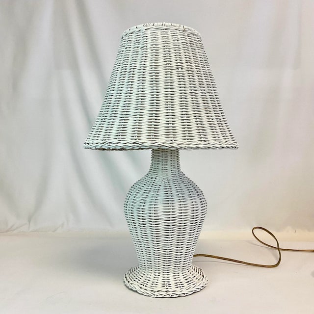Wicker table lamps are always a good decor choice. This Mid-Century lamp of white wicker is designed with both a wicker...